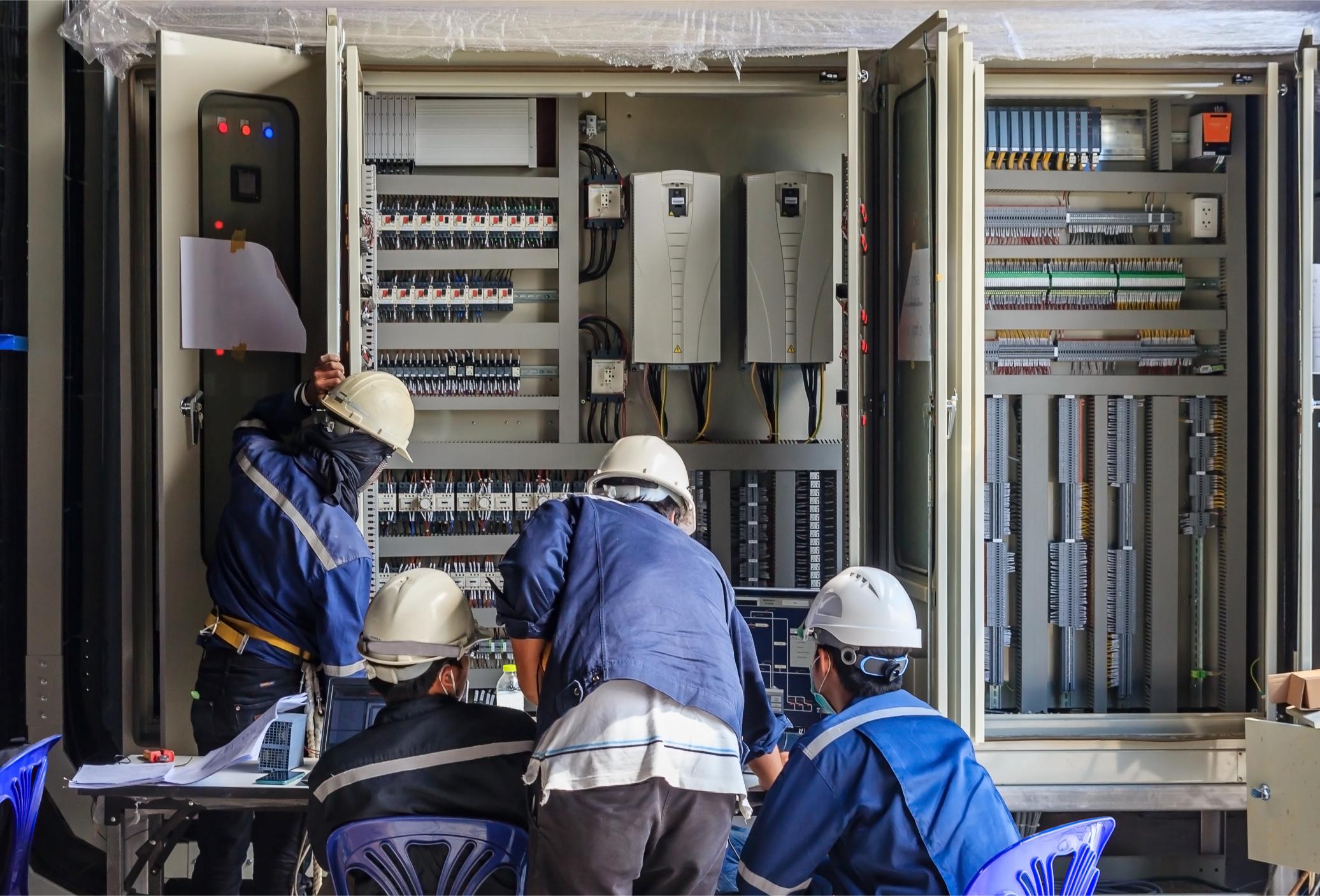 engineer working checking maintenance equipment wiring plc cabinet 1 INNOVARED